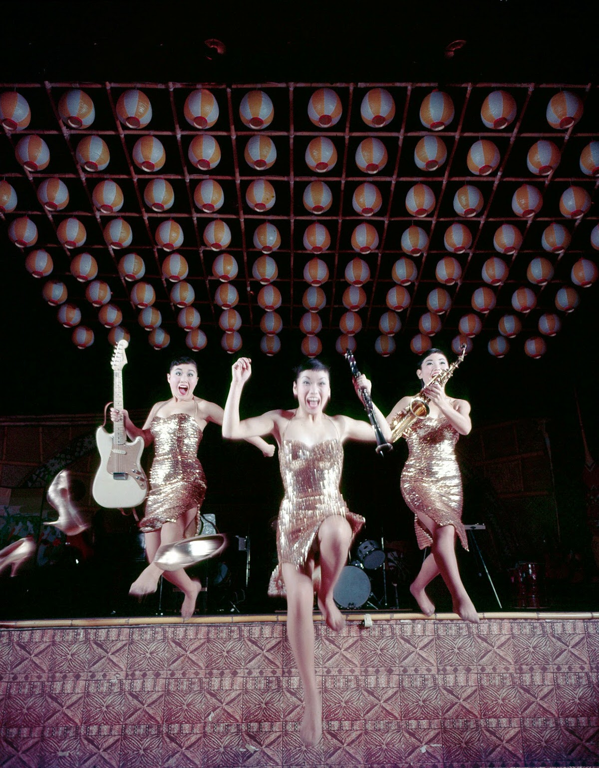 Min Ja, Sook Ja, and Ai Ja leaping off stage after performing Five Foot Two, ,1960
