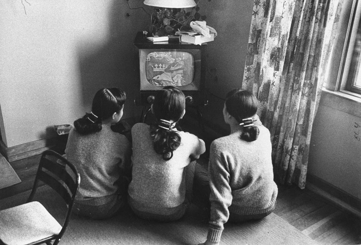 The Kim Sisters watching Queen for a Day at a farm in Marengo, Illinois, ,1960