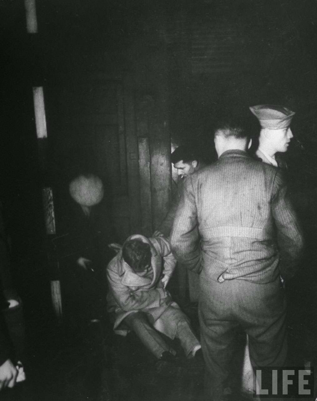 Wounded soldier passed out on the street during the blackout, 1940s