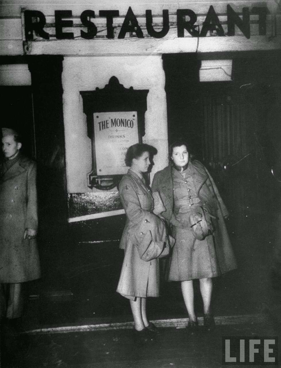 Girls standing outside Monico's in Piccadilly, 1940s
