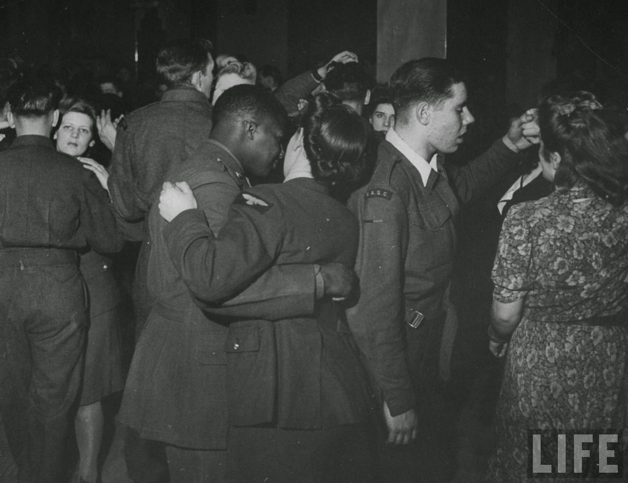 African American soldier dancing with a British Women's Auxiliary Air Force member at Paramount Dance Hall, 1940s