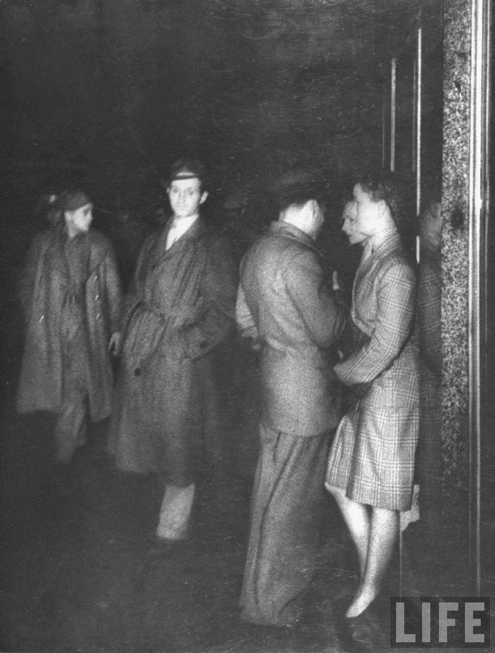 Girls talking with men outside the Rainbow Corner, 1940s