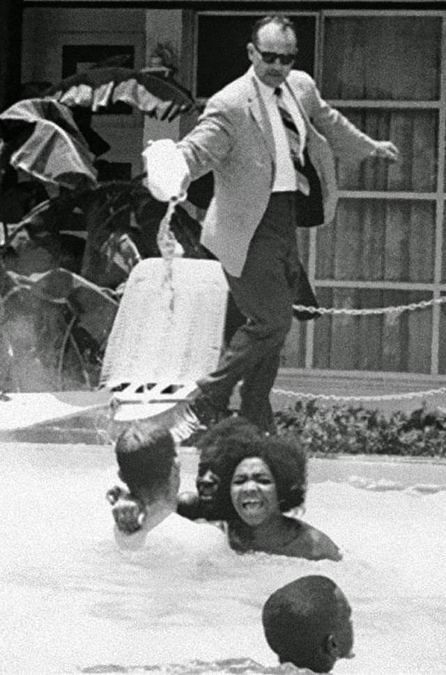 Shocking 1964 Photo Series Captured a Motel Manager Pouring “Acid” Into a Pool to Force Black People Out