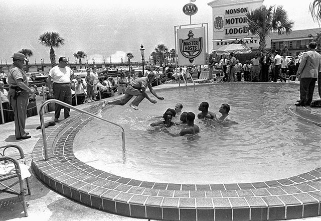 Shocking 1964 Photo Series Captured a Motel Manager Pouring “Acid” Into a Pool to Force Black People Out