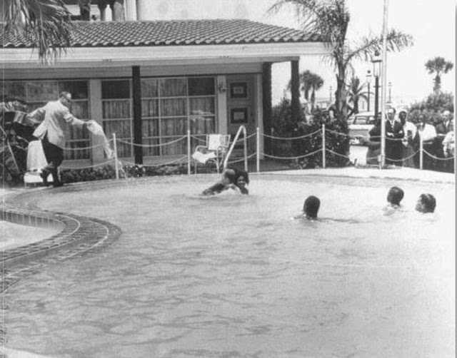 Shocking 1964 Photo Series Captured a Motel Manager Pouring “Acid” Into a Pool to Force Black People Out
