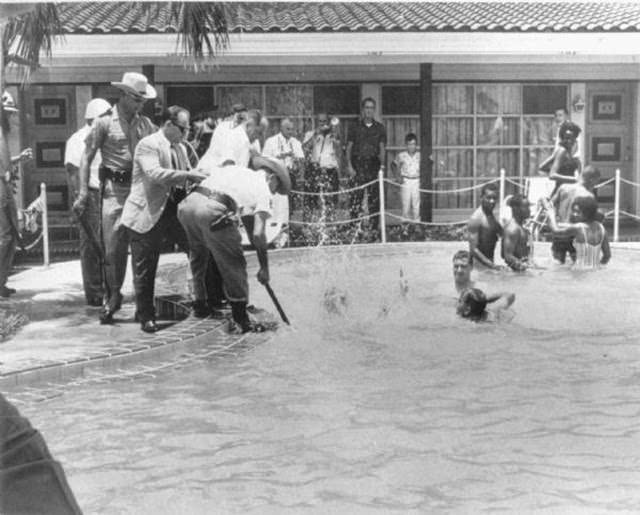Shocking 1964 Photo Series Captured a Motel Manager Pouring “Acid” Into a Pool to Force Black People Out