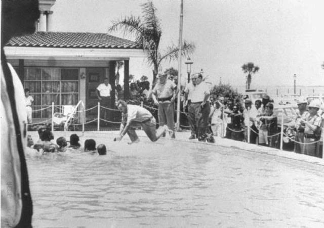 Shocking 1964 Photo Series Captured a Motel Manager Pouring “Acid” Into a Pool to Force Black People Out