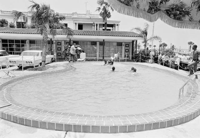 Shocking 1964 Photo Series Captured a Motel Manager Pouring “Acid” Into a Pool to Force Black People Out