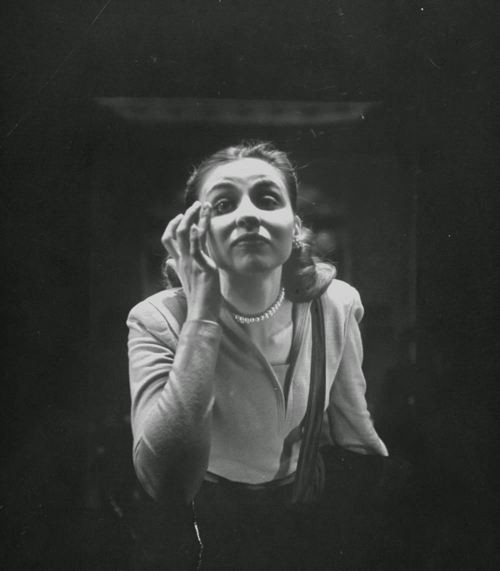 Woman smoothing her eyebrow