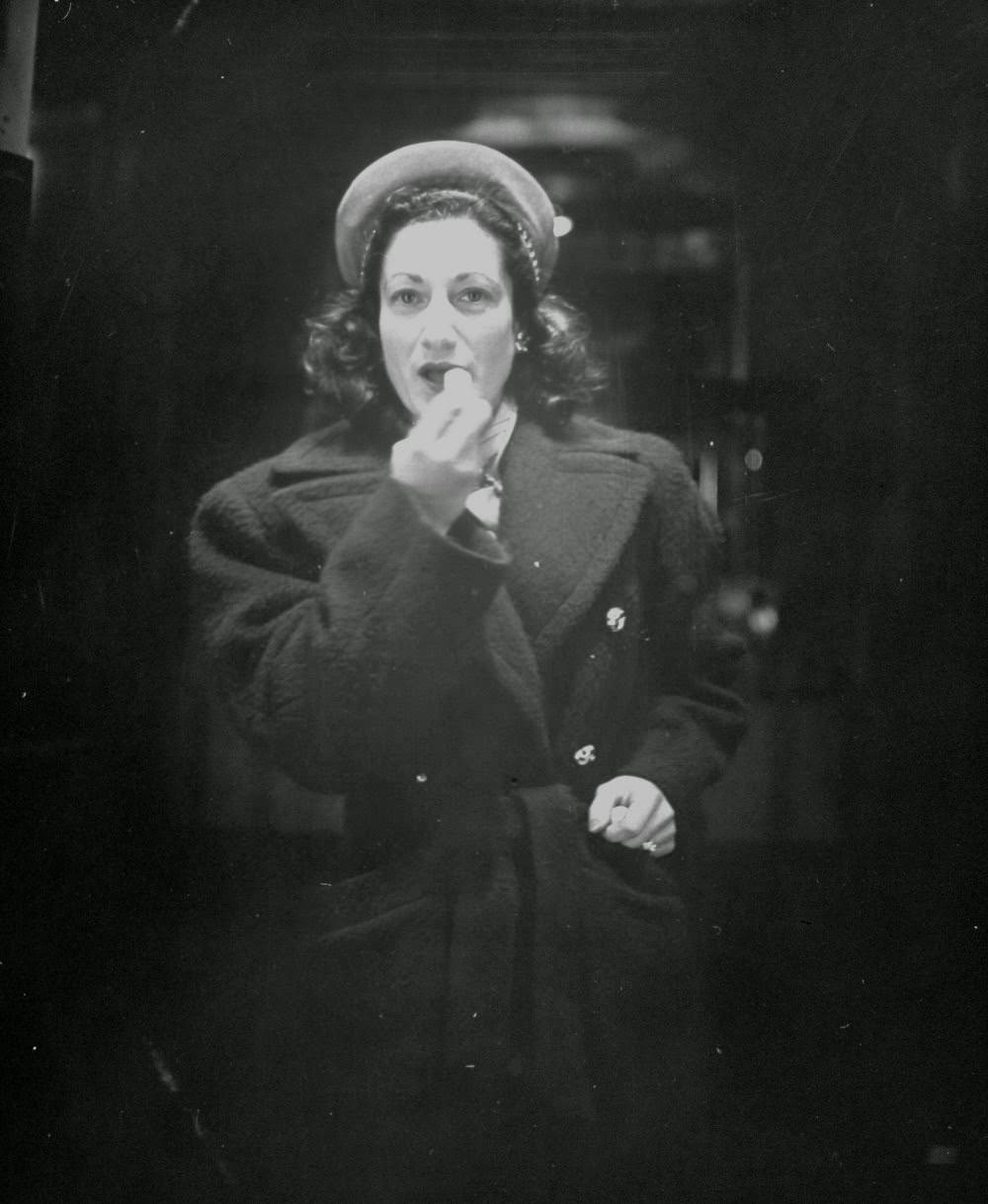 Woman applying lipstick