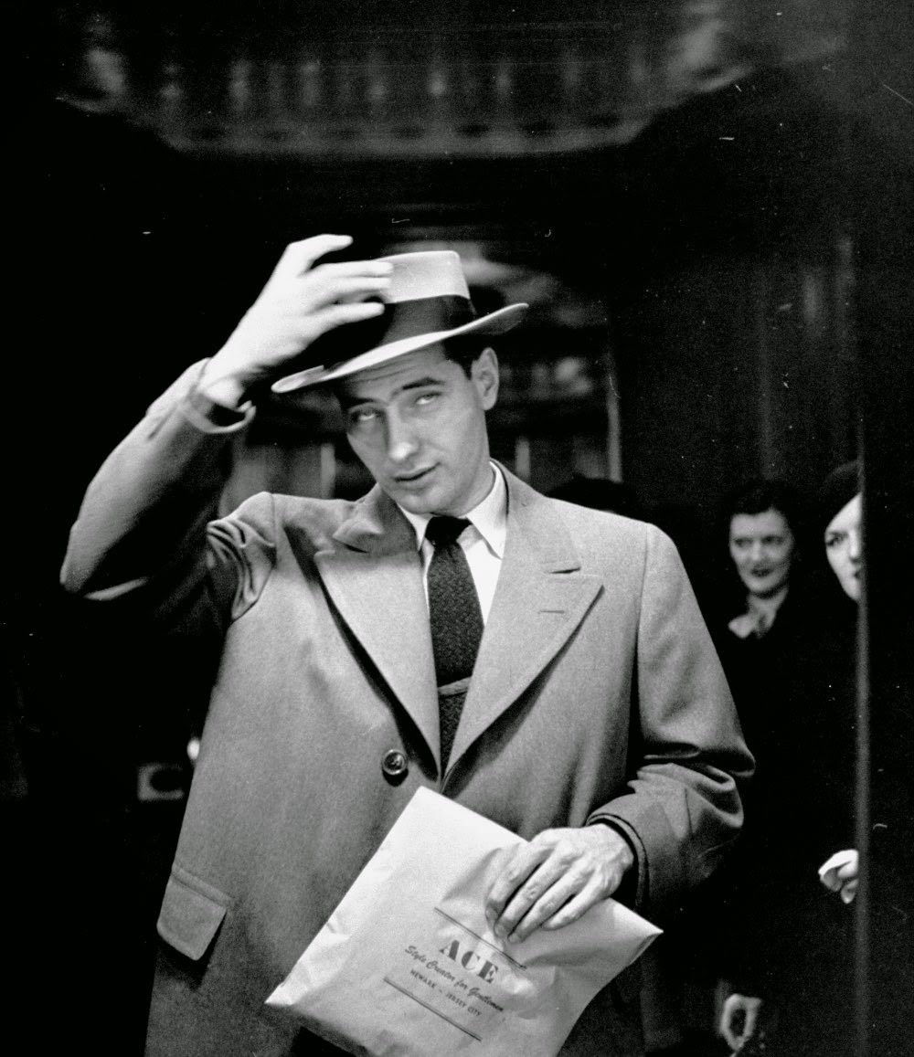 Man setting his hat in place