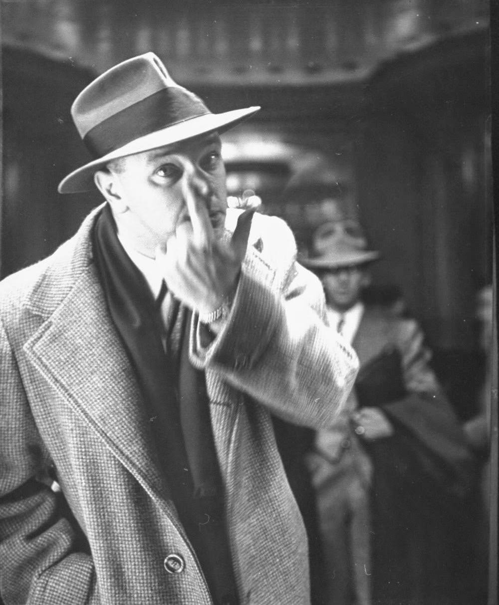 Man looking closely at the side of his nose