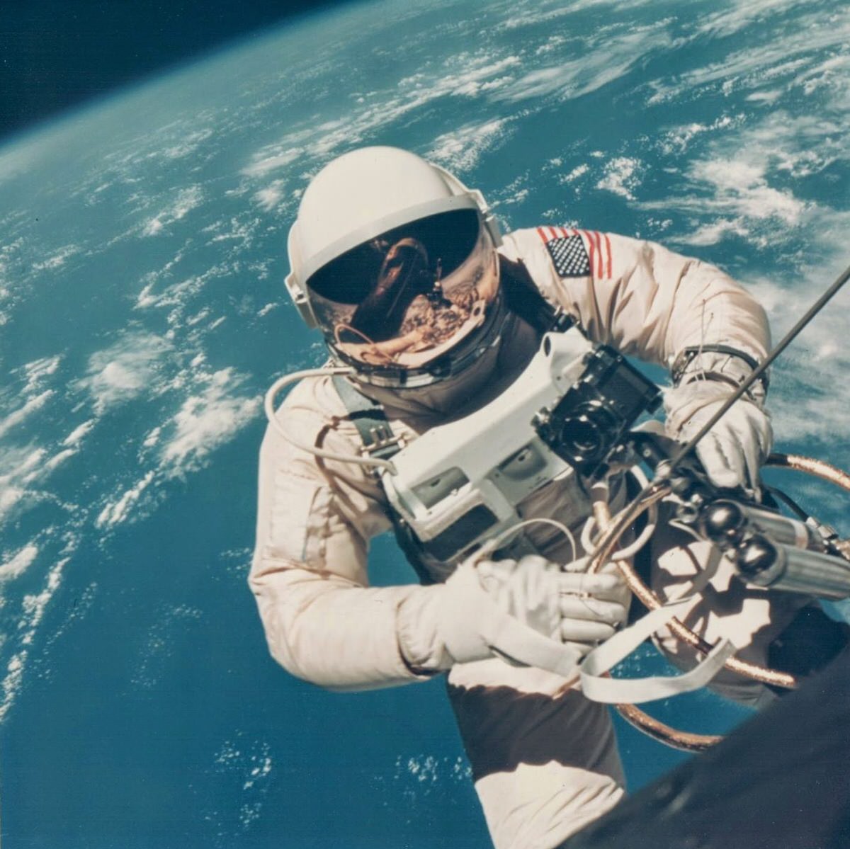 James McDivitt, Ed White walking in space over Hawaii, Gemini 4, June 1965.