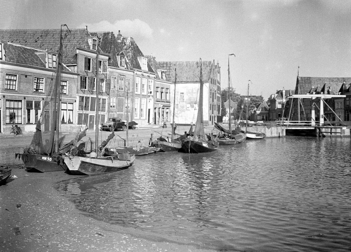 Boats and streets along a canal in Holland, 1921
