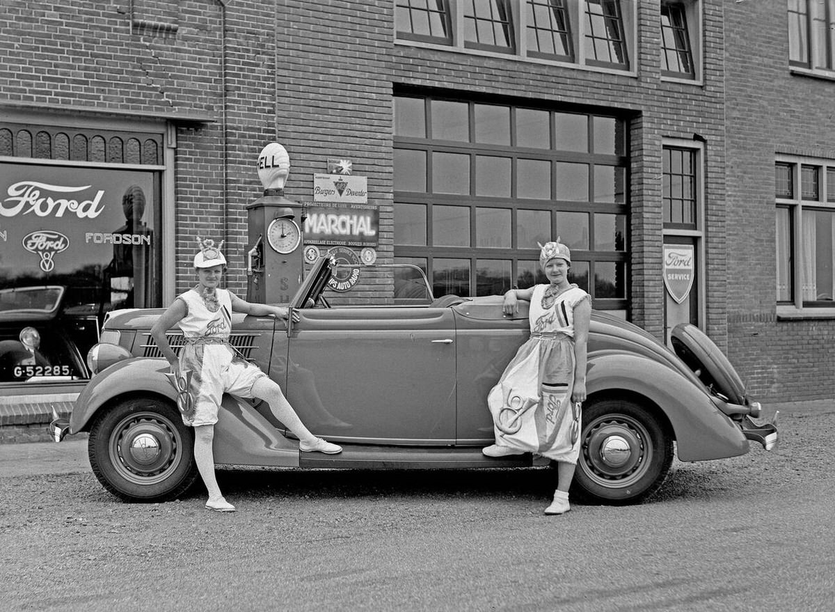 Two women posing with a Ford car in the Netherlands, 1930