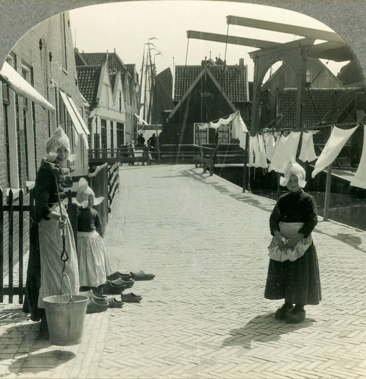 Washday in Volendam featuring residents and their wooden clogs, 1930s