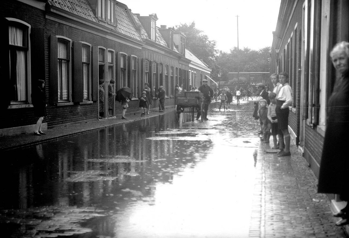 Street scene in a Dutch city after rain, 1930