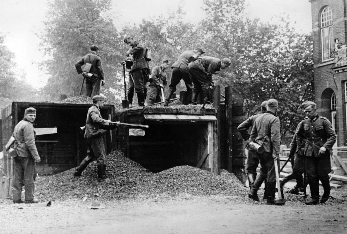 German Wehrmacht engineers removing bunkers and street blocks during the advance into the Netherlands, 1940