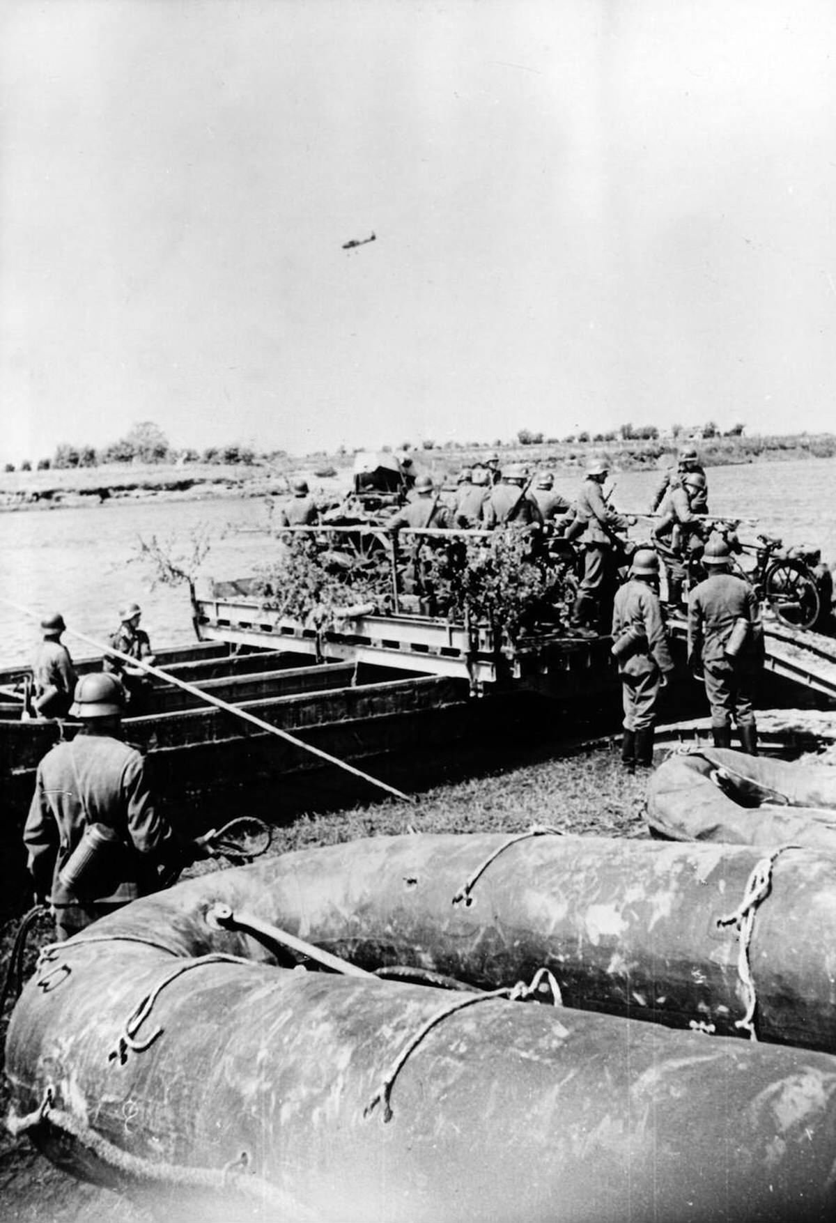 German Wehrmacht soldiers crossing the Maas river during the advance into Holland, 1940