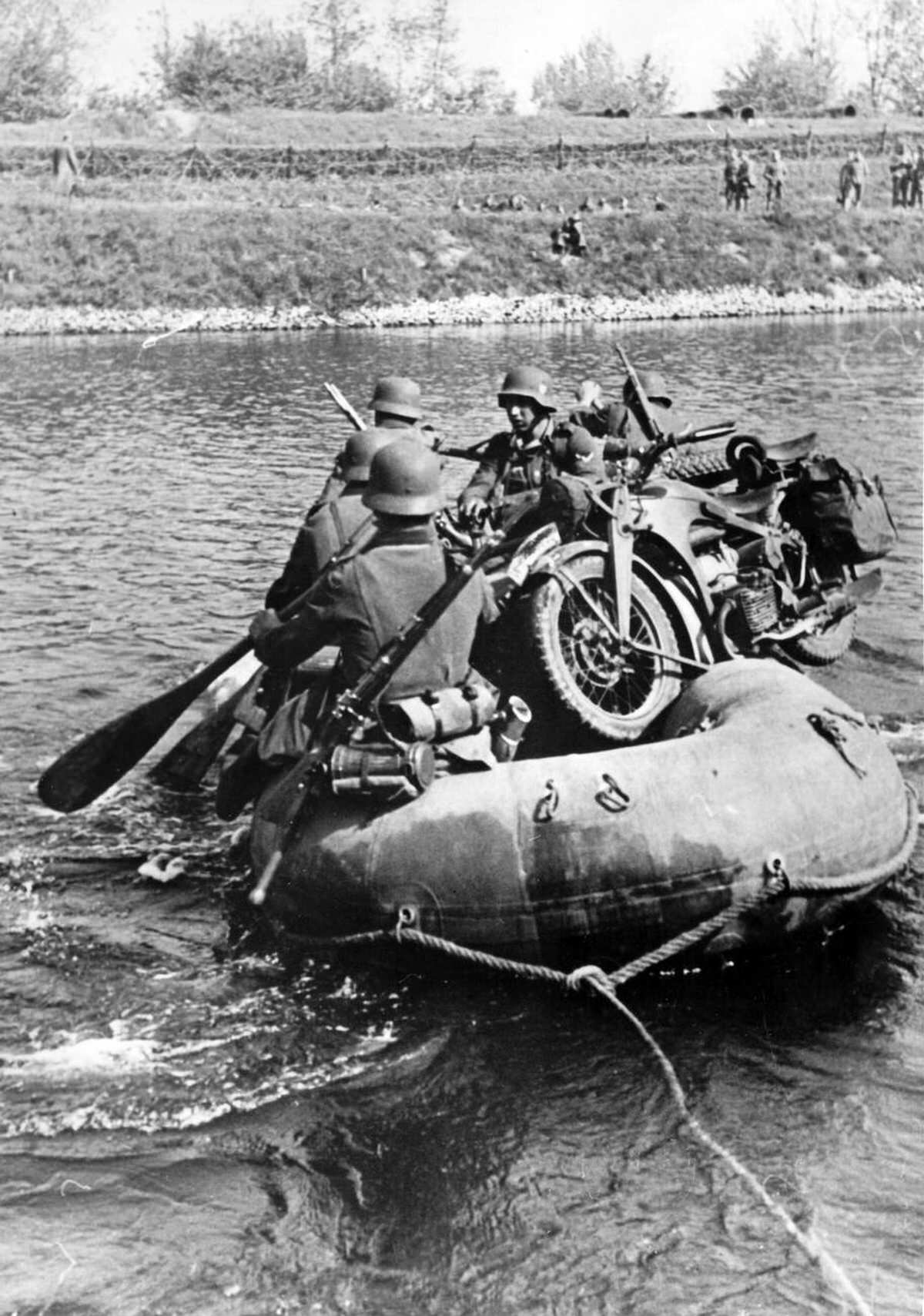 German Wehrmacht soldiers crossing the Maas river near the Peel-Raam defensive line, 1940