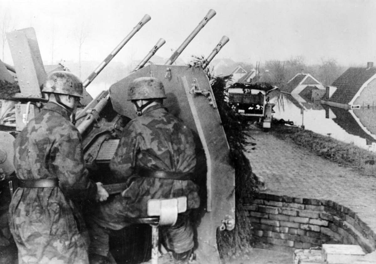 German Wehrmacht soldiers with an anti-aircraft gun in a flooded village, 1945