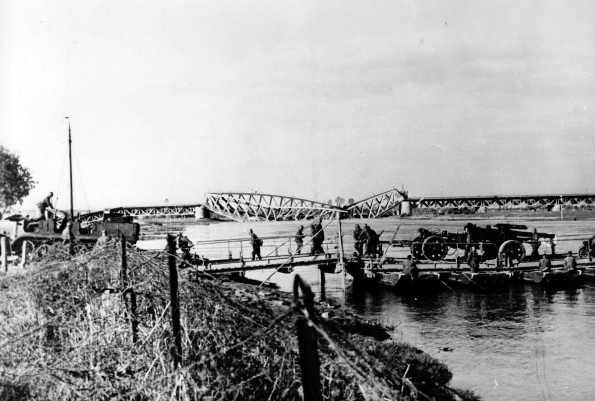 German troops crossing a pontoon bridge over the IJssel river after the original bridge was blown up by the Dutch, 1940