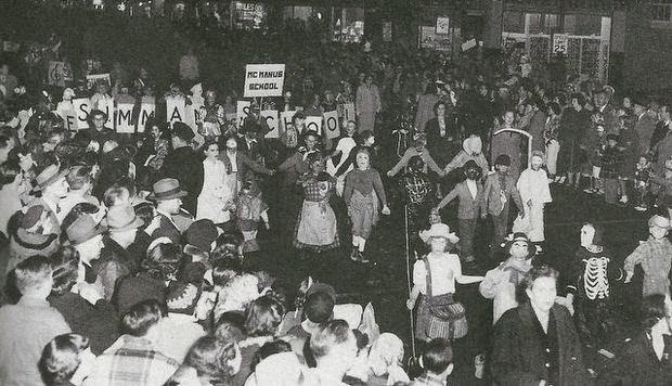 Marchers in Linden's 1952 Halloween parade pass the 300 block of Wood Avenue. Courtesy of the Linden Historical Soicety.