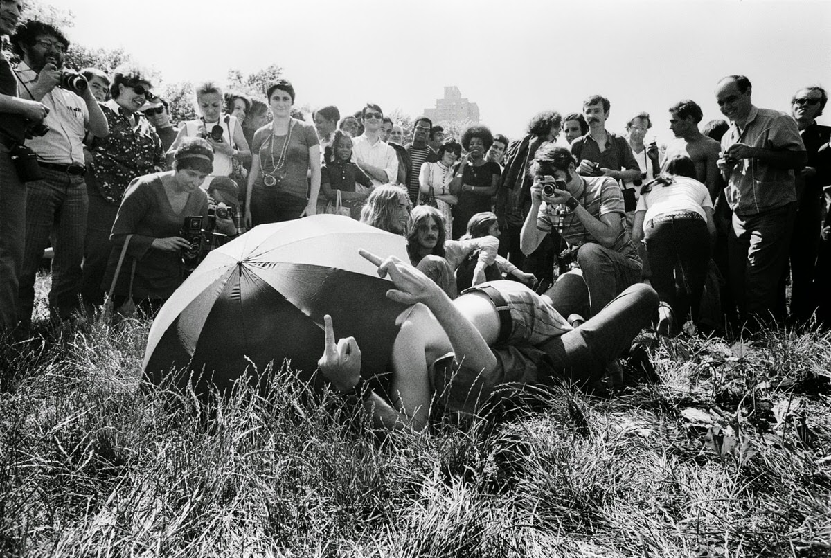 Two men ‘flip the bird’ at the Central Park crowd that’s formed as they compete in the kissing contest during New York’s inaugural Gay Pride celebration on 28 June 1970.