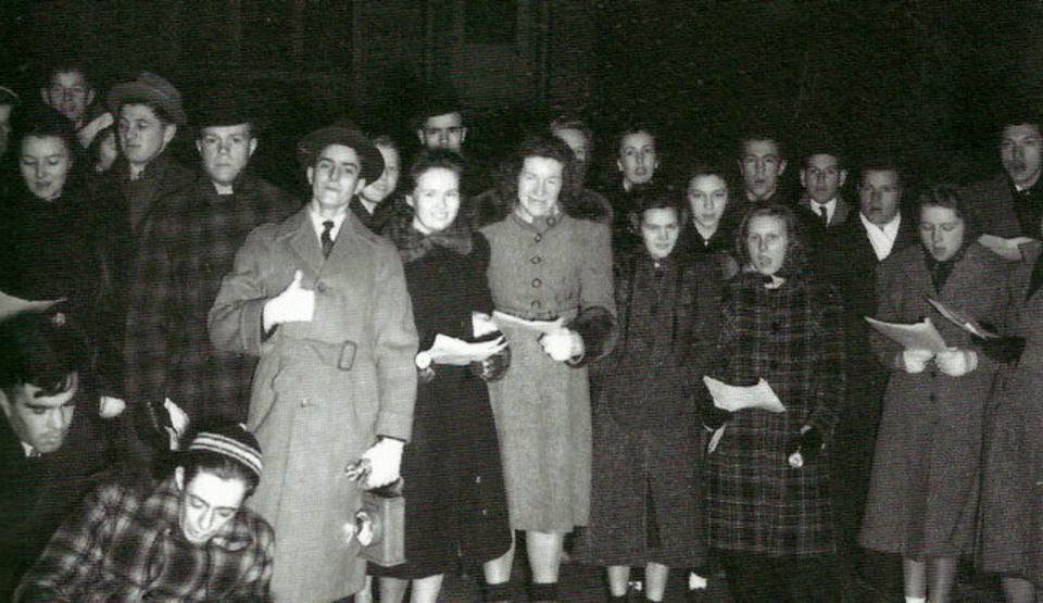 Parishioners from the Athenia Reformed Church singing carols on Colfax Avenue in Clifton, 1939
