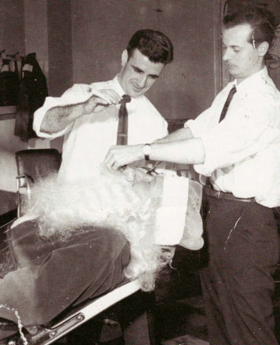 Angelo Falvo giving Santa Claus a trim at Chris' Barber Shop on Farnsworth Avenue in Bordentown, 1950s