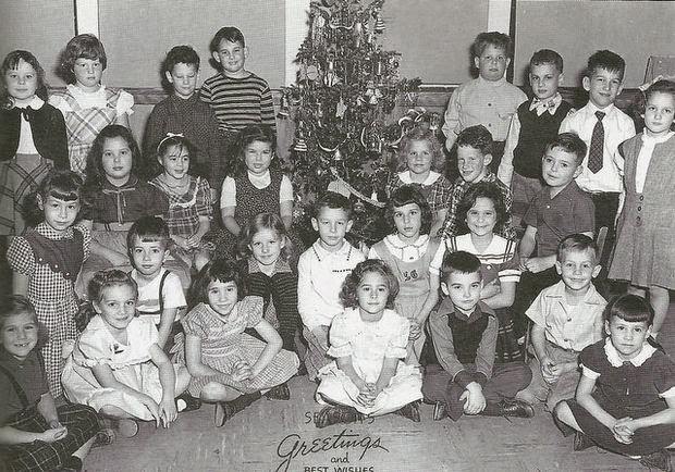 Students posing in front of a Christmas tree at the Horace Mann School in Bayonne, 1912