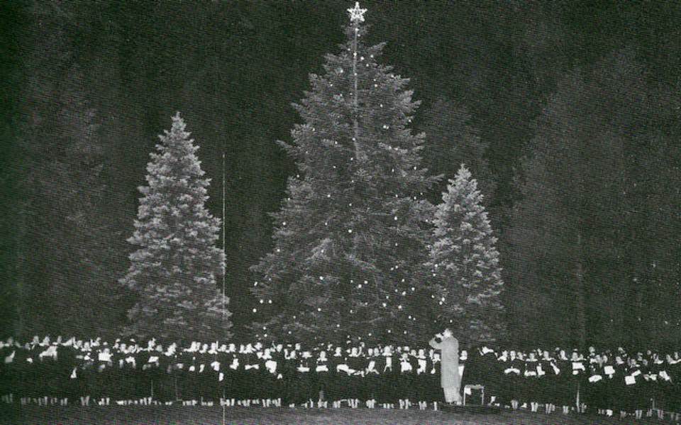 Students gathering in front of the mansion to sing Christmas carols at Georgian Court University in Lakewood, 1947