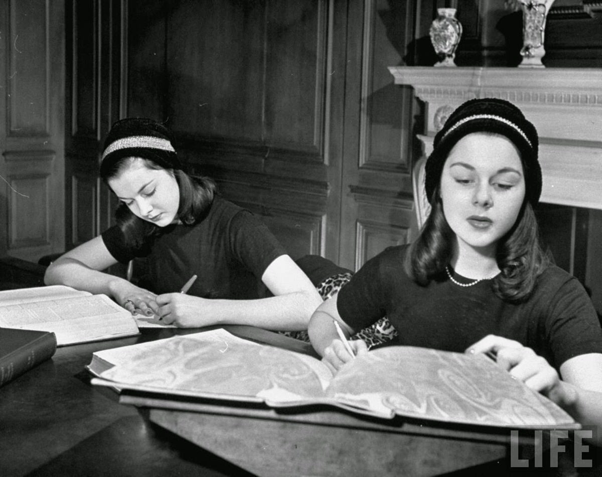 The O'Connor twins Gloria and Consuelo, studying in library, almost exacat look-alikes.