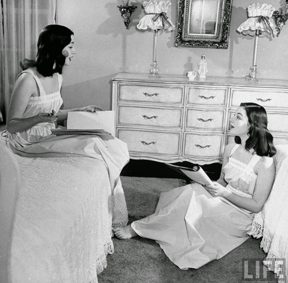 The O'Connor twins Gloria and Consuelo, sitting in bedroom, almost exacat look-alikes.