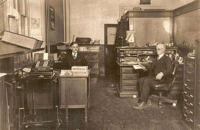 Office with a Burroughs electric bookkeeping machine.