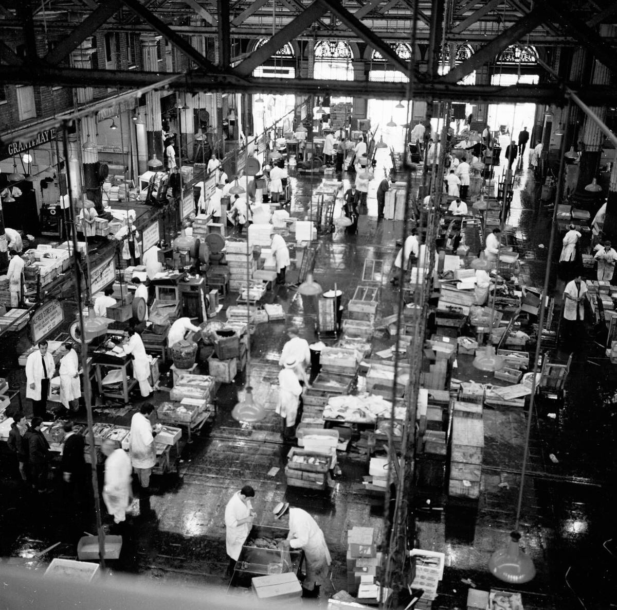 Fishmongers working on the floor at Billingsgate Fish Market, 1950s