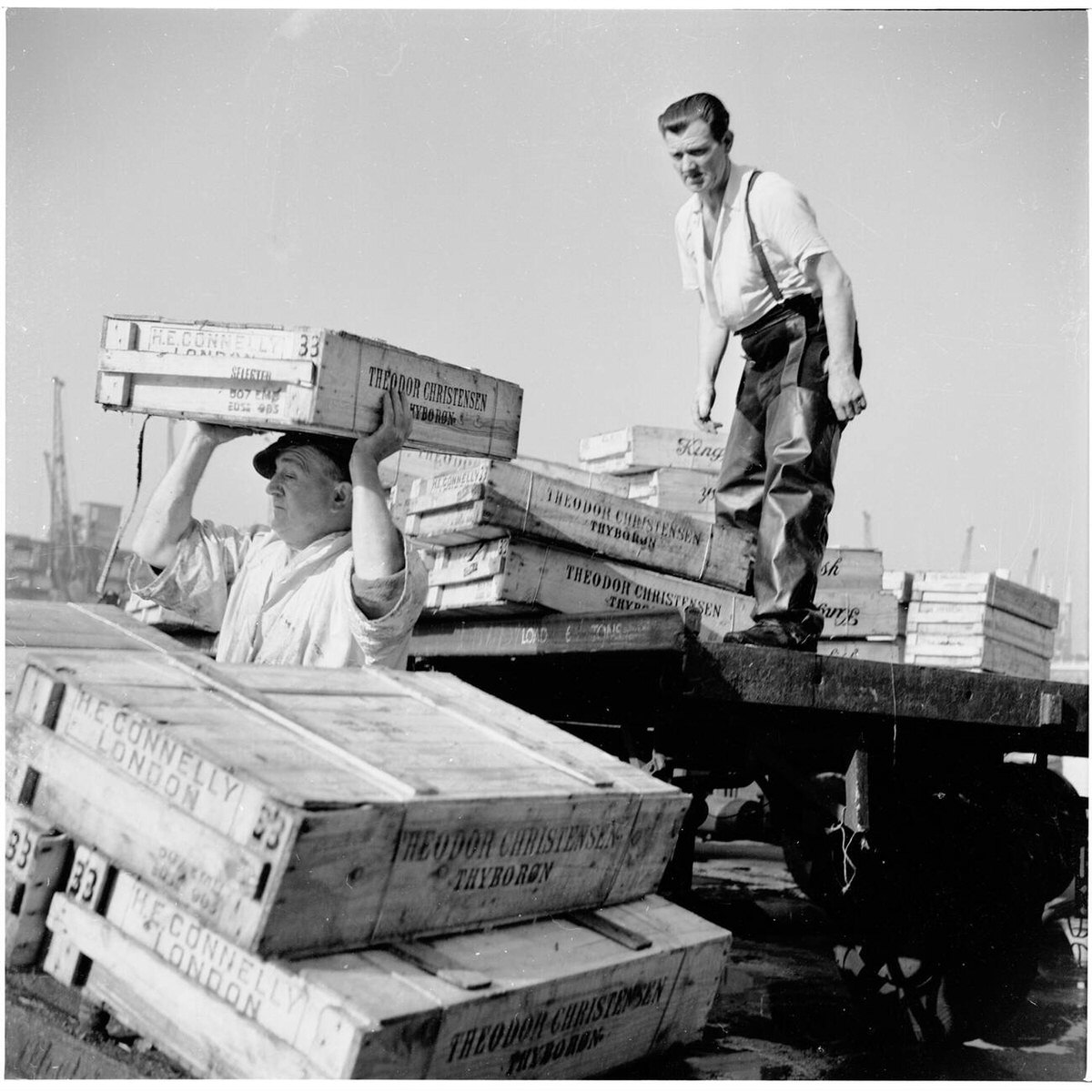 Workers unloading crates of fish from a lorry at New London Bridge, 1950s