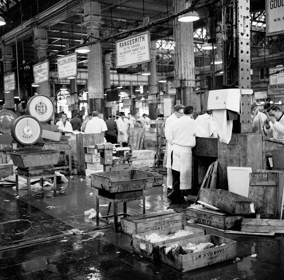 Fishmongers working inside Billingsgate Fish Market, 1950s