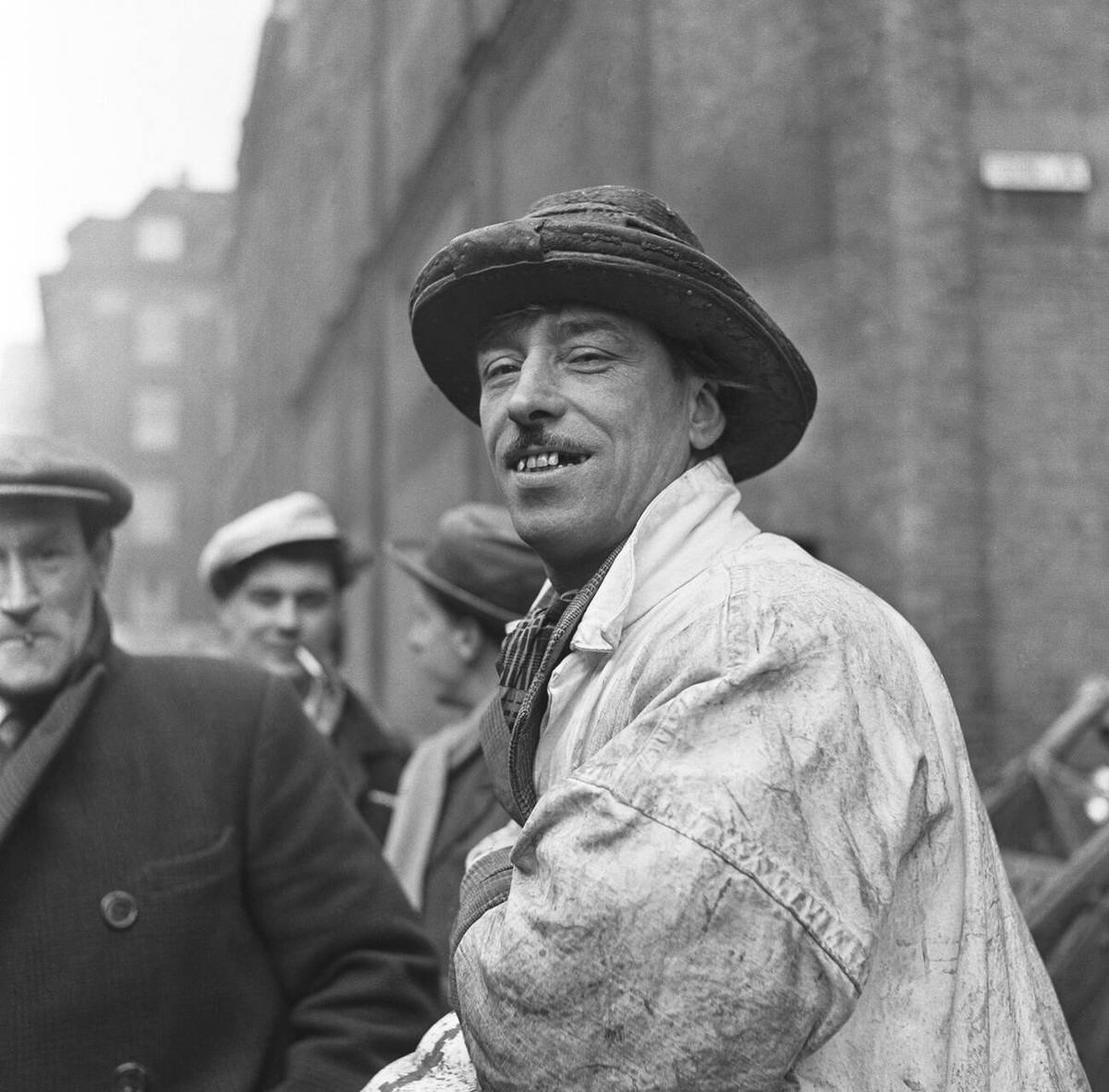 Fish porter wearing a distinctive hat at Billingsgate Fish Market, 1954
