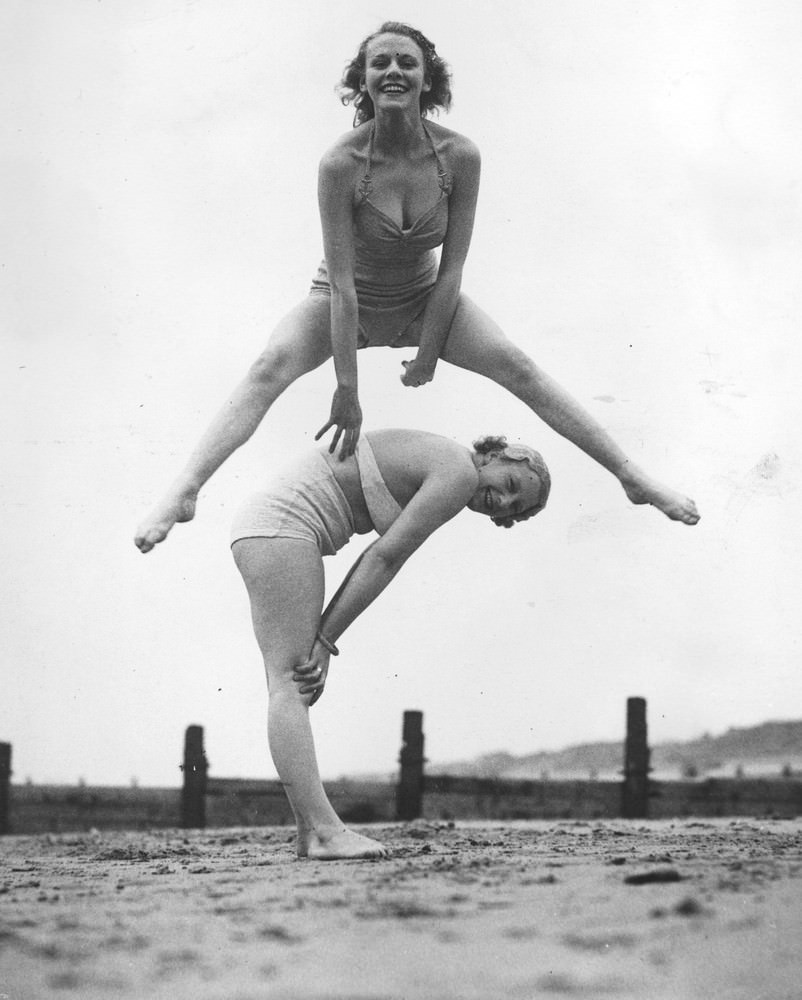 Women playing leapfrog on the beach at Blackpool, 1936