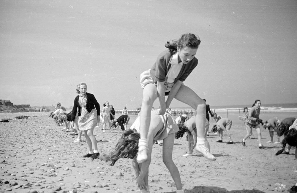 Pupils playing leapfrog on the beach at Hornsea, 1948
