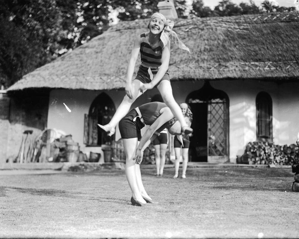 Friends playing leapfrog by the river at Harwell, Oxfordshire, 1929