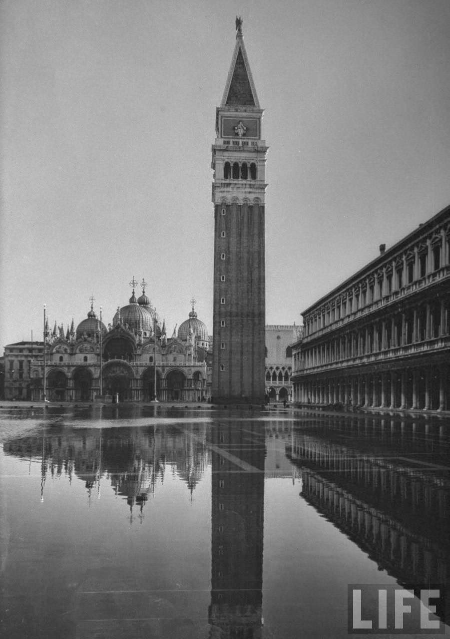 Flooded Piazza San Marco with St. Mark's Church in the background.