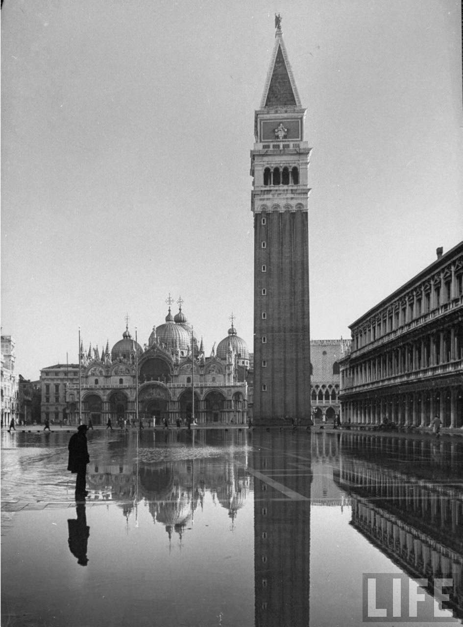 Flooded Piazza San Marco with St. Mark's Church in the background.