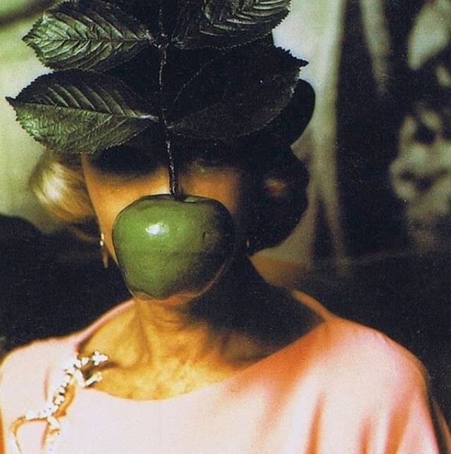 The following costume made reference to the famous painting The Son of Man, making a direct biblical reference to Eve eating the forbidden fruit from the Garden of Eden.