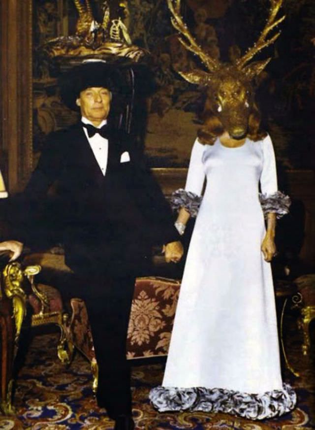 Meet the hosts of the ball: Guy de Rothschild & Marie-Hélène de Rothschild wearing a horned “giant’s head” with tears made from real diamonds.