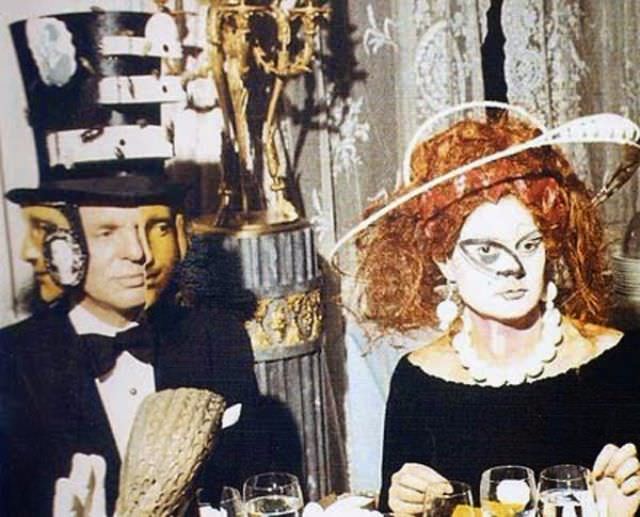 Baron Alexis de Redé in a Dalí designed Hat and Mrs. Espírito Santo.