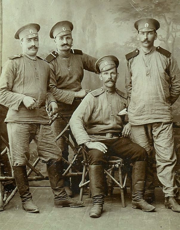 Russian officers in traditional blouses and boots, 1910s