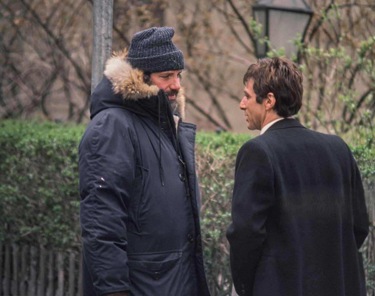 Film director Brian De Palma talking with actor Al Pacino on the set of 'Scarface', Los Angeles, 1983.