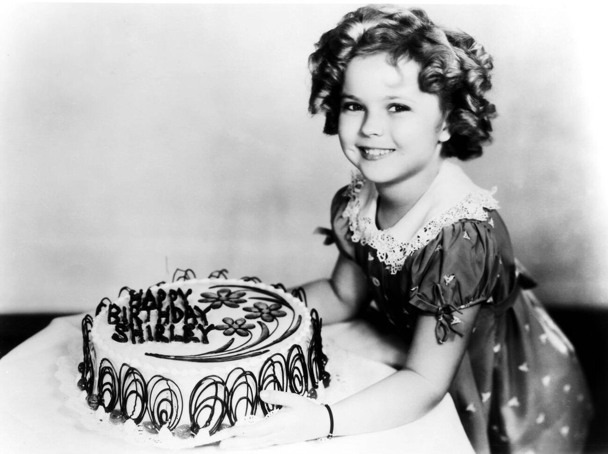 Shirley Temple with a birthday cake, 1936